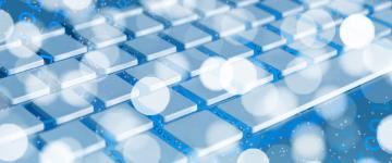 Close-up of a computer keyboard in shades of blue, overlaid with glowing white lights and translucent binary code. (Pixabay /Gerd Altmann) 