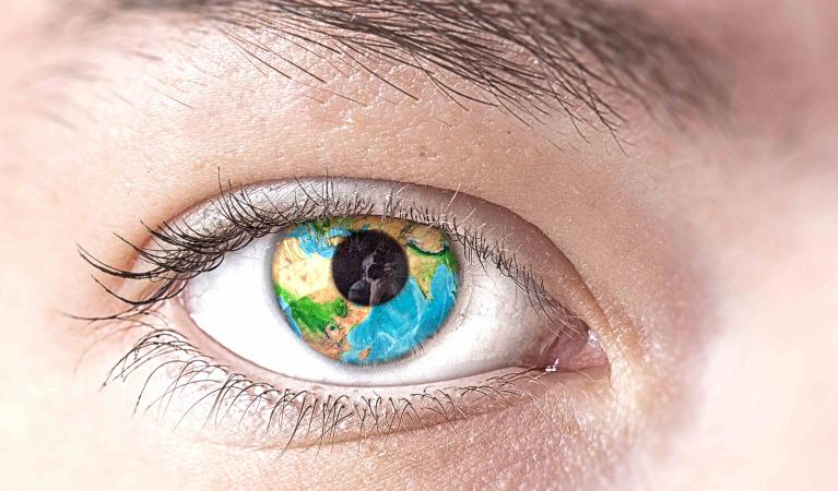 Human eye with planet Earth. 