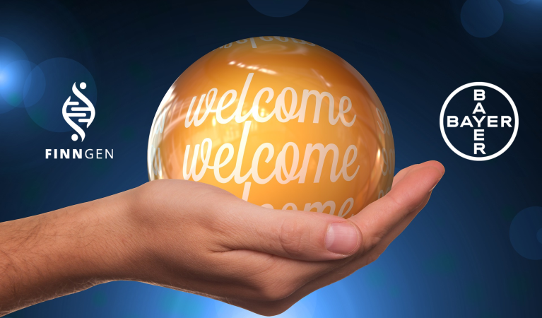 An image showing a hand holding a glowing orange sphere with "welcome" written on it, flanked by the FinnGen and Bayer logos.