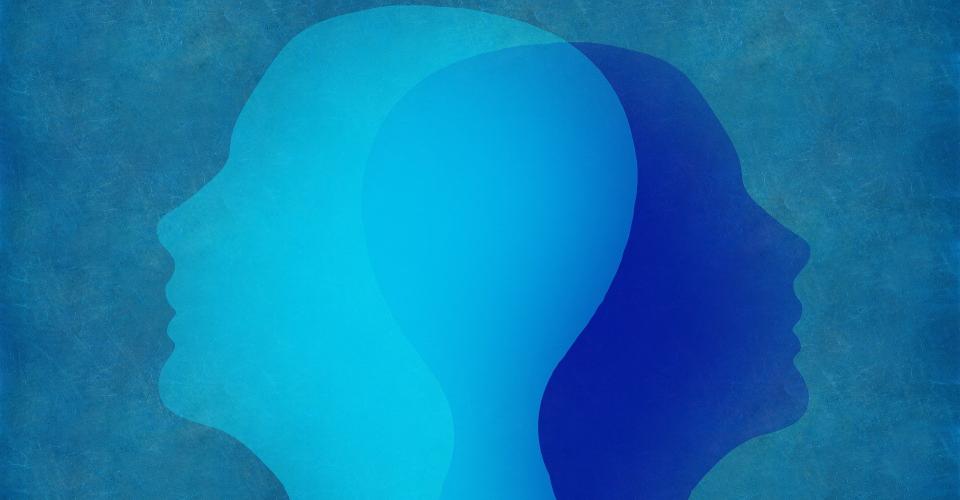 A blue-toned abstract image showing two superimposed human profiles.
