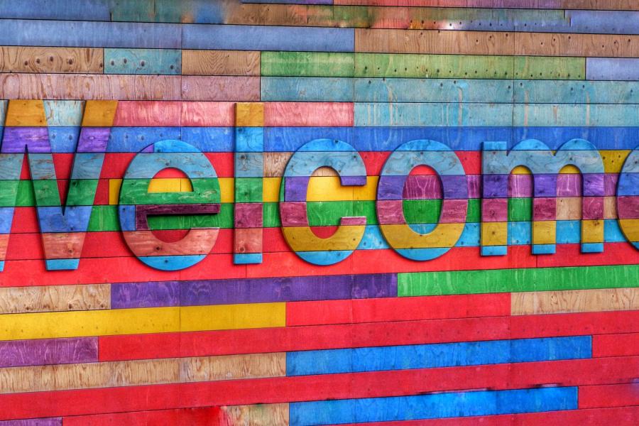 Text "welcome" on a very colorful background.